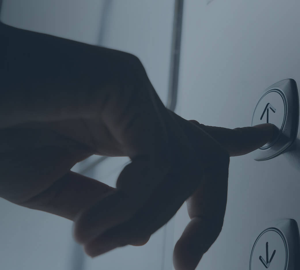 Person pressing elevator button